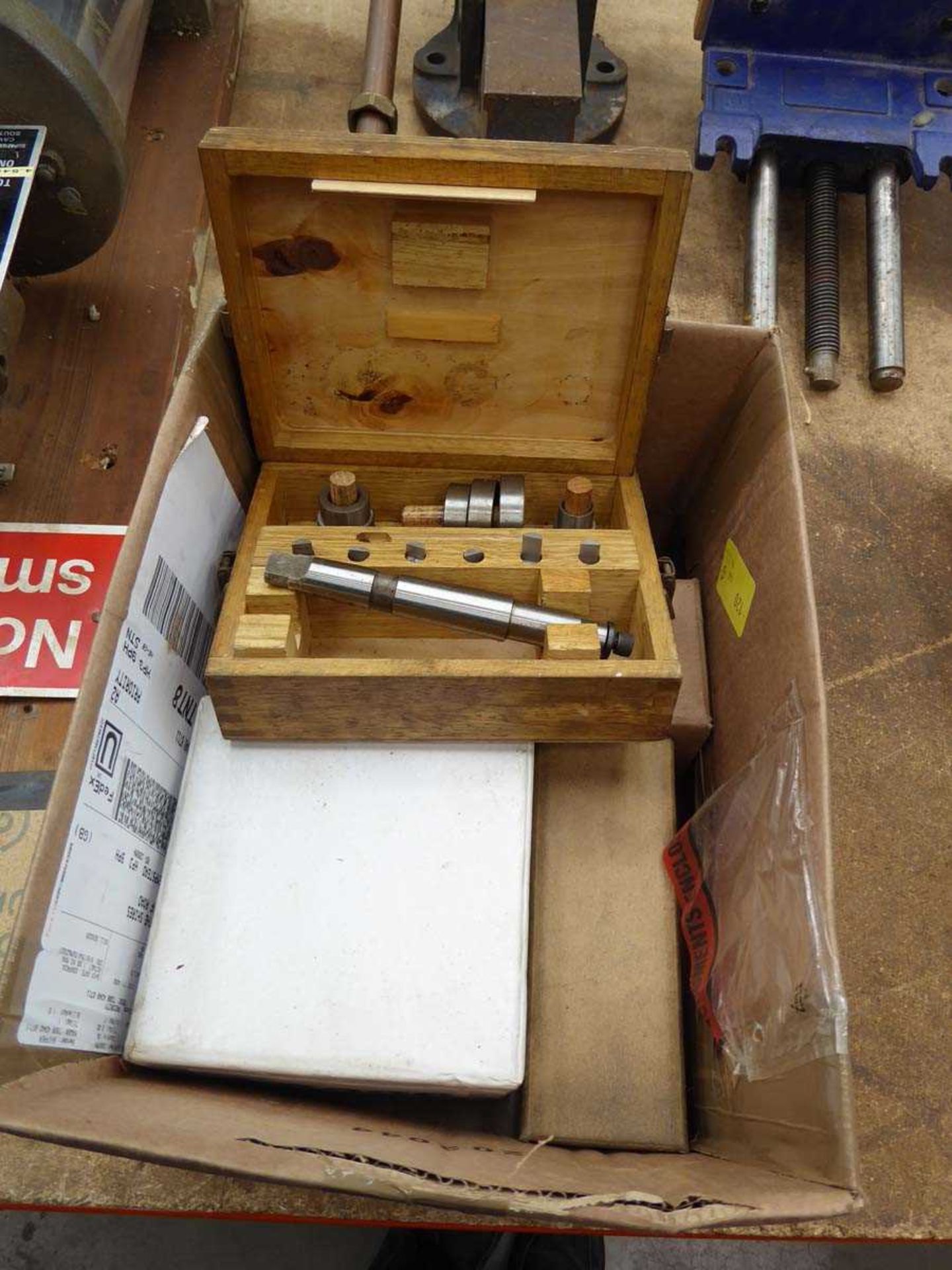 Box containing lathe parts