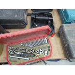 Dent puller and box containing small socket set