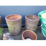 2 large terracotta planters with faces