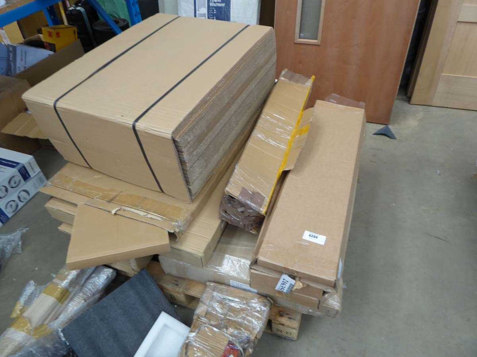 +VAT Pallet containing items inc. cardboard sheets, plastic display parts, and flatpack unit