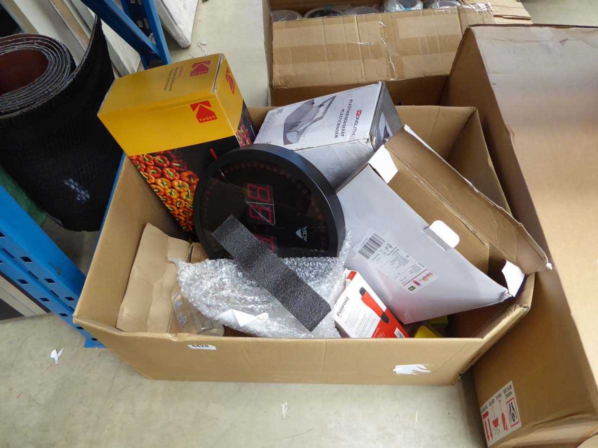 Box of assorted items to include toner cartridge, clock, etc