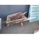 Wooden wheelbarrow In need of repair