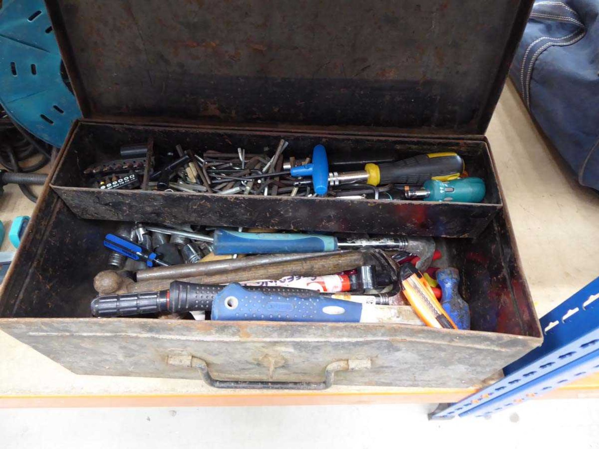 Metal toolbox containing various small tools