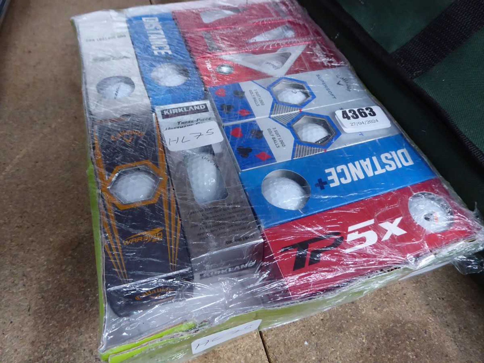 Box containing assorted golf balls