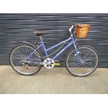 Raleigh purple lady's bike with front basket