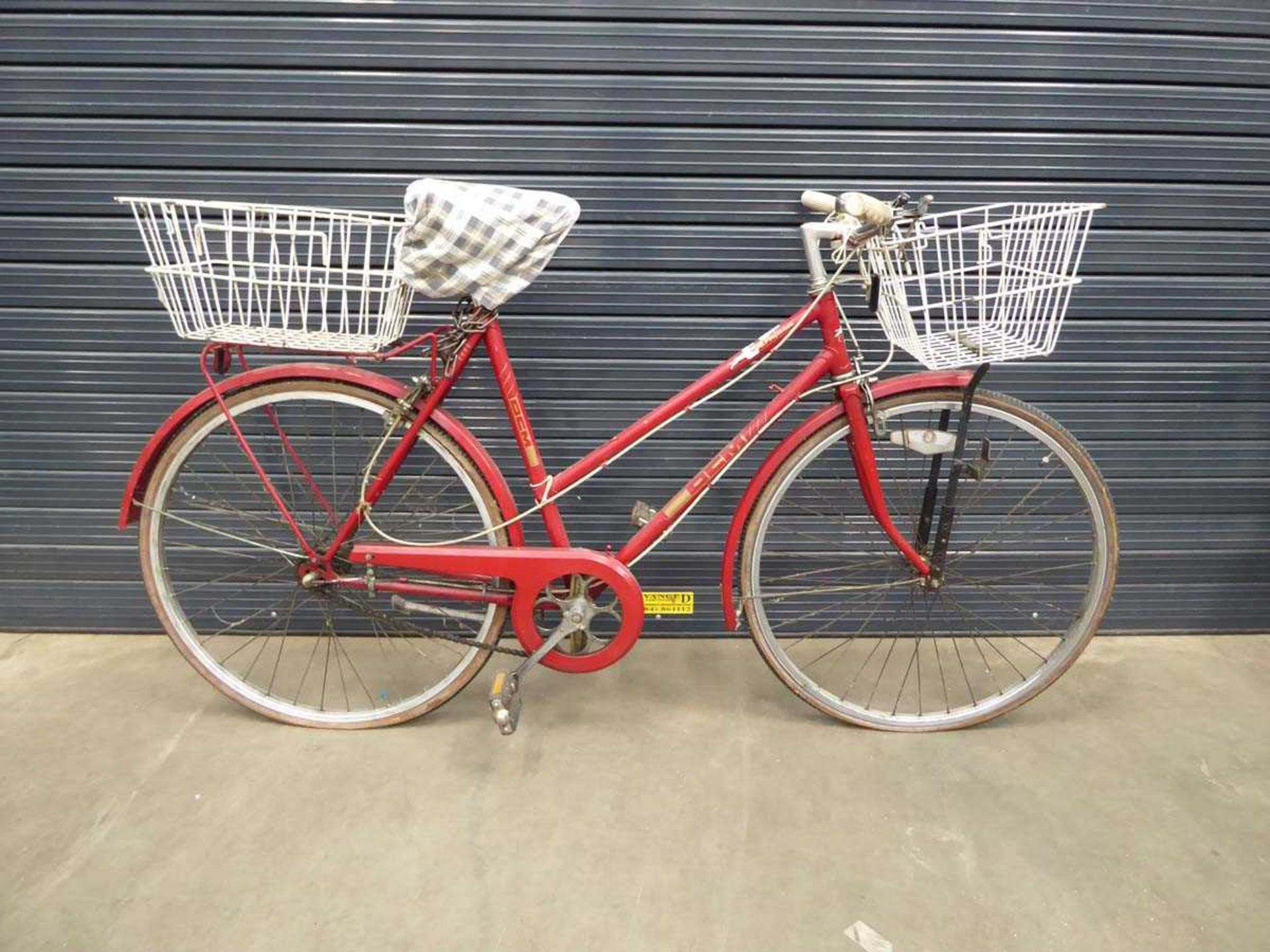 Red lady's bike with front and back basket