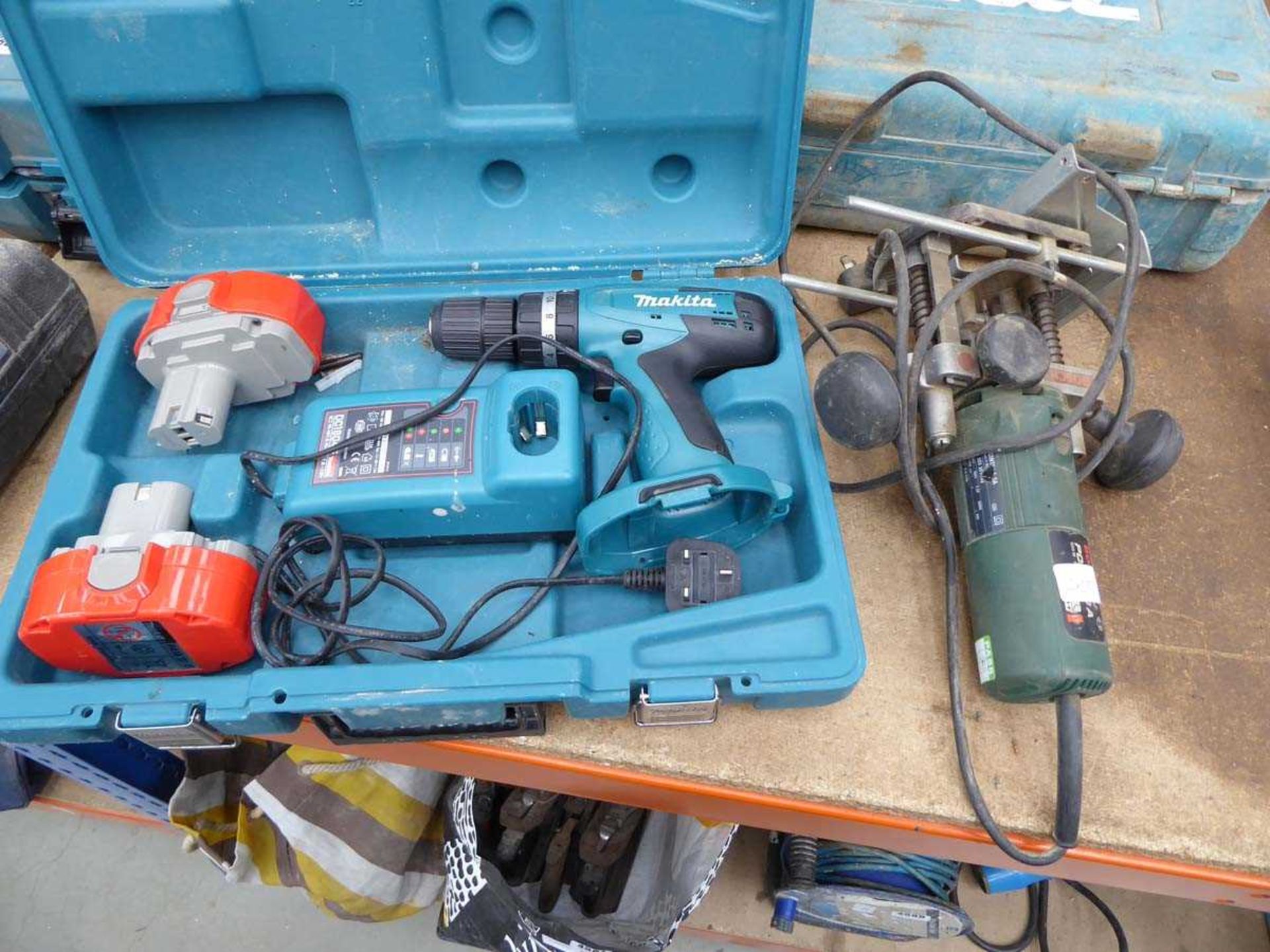 Makita battery drill with 2 batteries and charger together with Bosch router