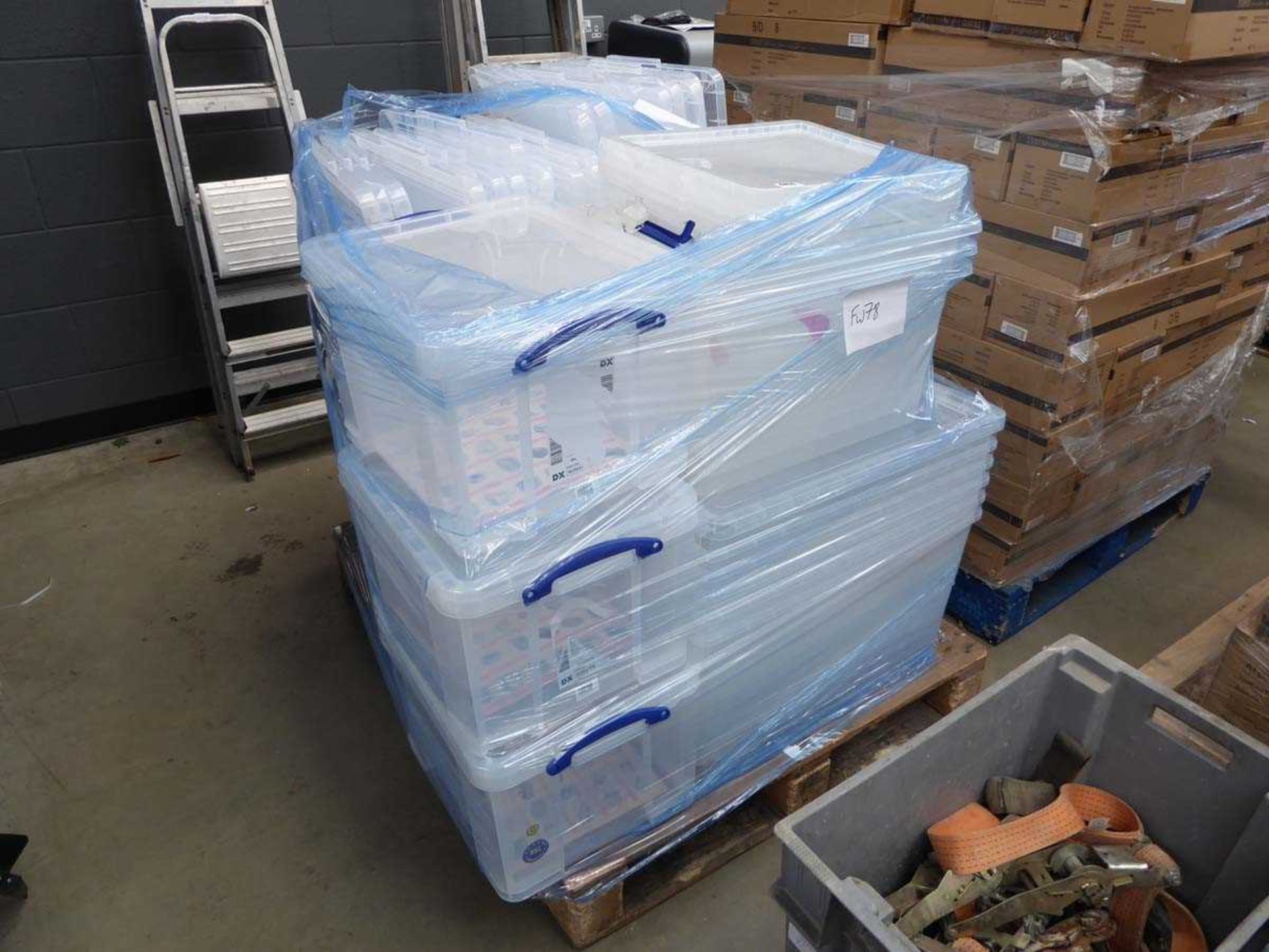 Pallet of plastic storage boxes