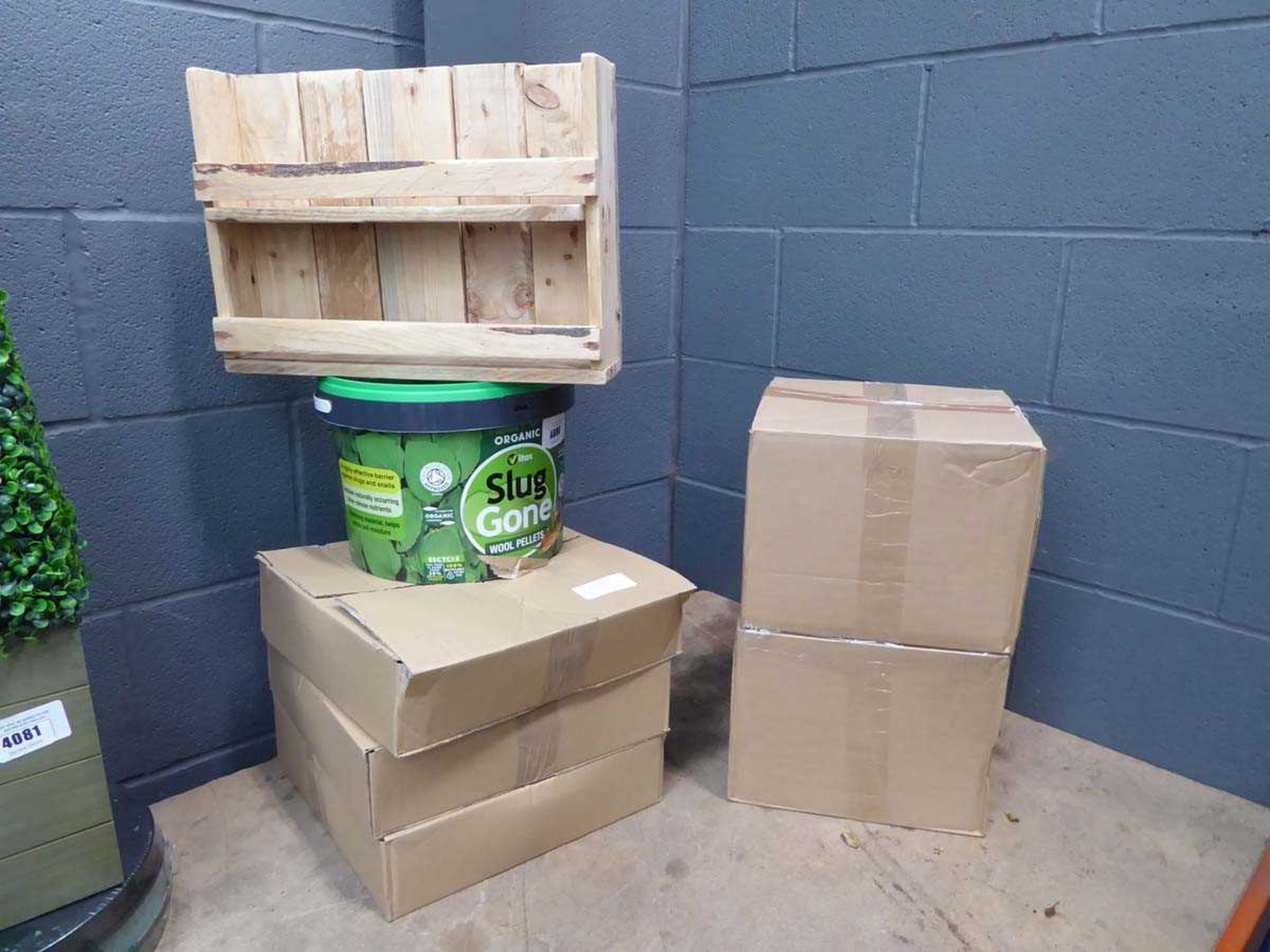 +VAT Slug pellets, small wooden rack, 2 boxes of tomato plant holders, and other garden items