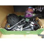 Box of bike parts and accessories including pedals, mud guards, stand, bike computers, power packs