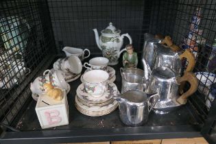 Cage containing Picquot Ware tea service plus floral patterned crockery and a money box