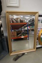 Rectangular bevelled mirror in gilt frame