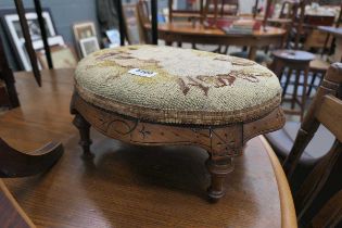 Footstool with floral patterned surface