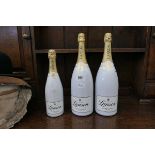 Three champagne bottles