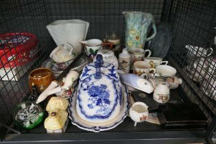 Cage containing crested and commemorative ware, lidded cheese dish, ornamental cottages plus vases