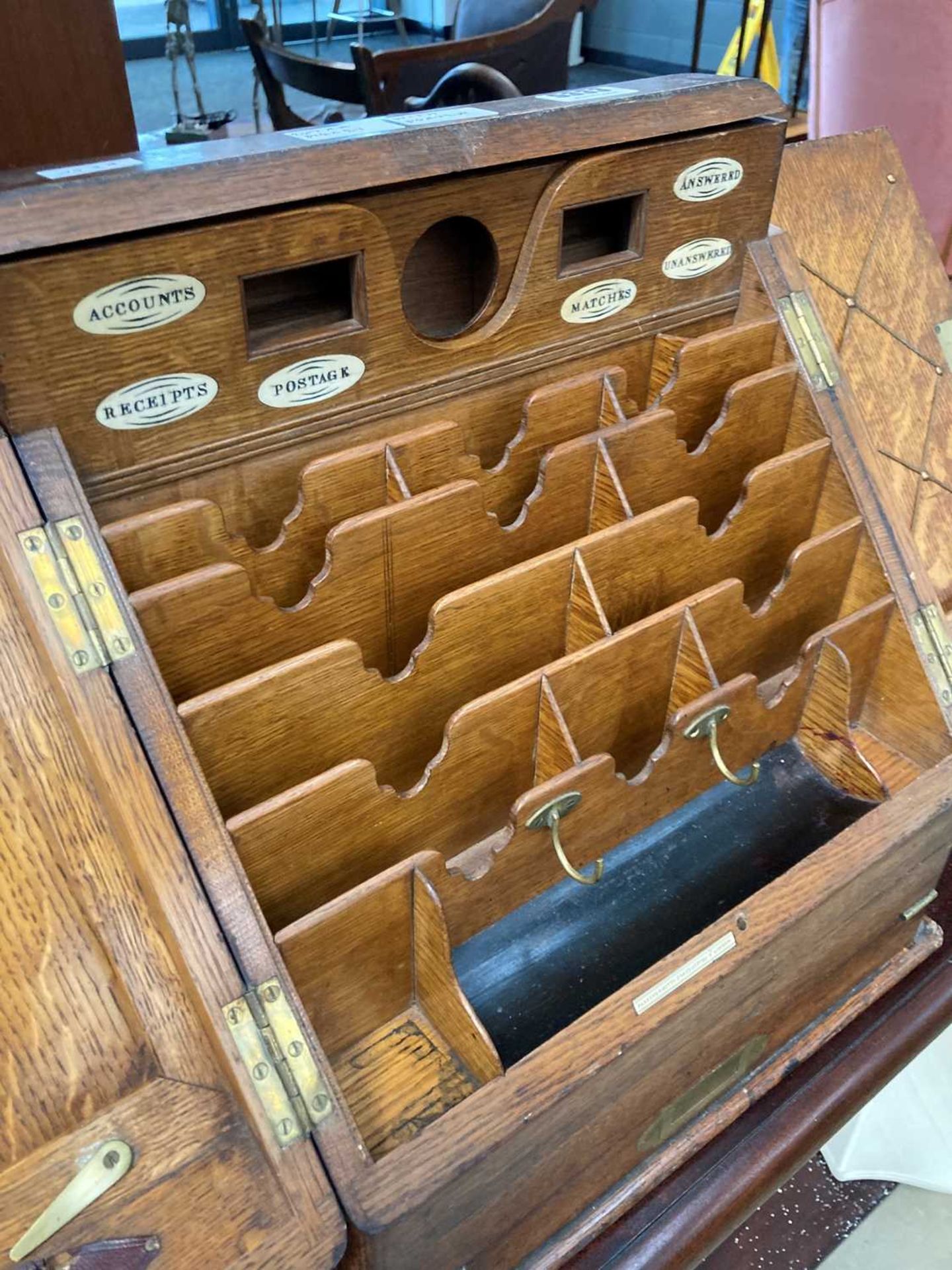 Oak letter rack with writing slope under made by Parkins and Gotto, Oxford Street, London - Image 3 of 3