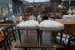 Pair of aesthetic movement upholstered dining chairs
