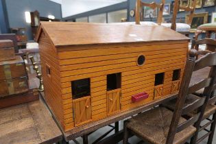 Stable shaped dolls house