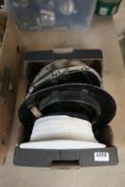 Box containing military helmets and cap