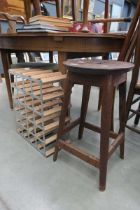 Metal and pine wine rack plus a laboratory stool