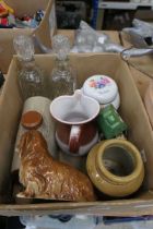 Box containing decanters, foot warmer, ginger jar, ornaments and candlestick