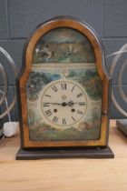 Dome topped mantel clock in walnut case