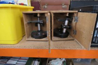2 boxes containing student microscopes