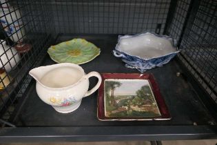 Cage containing 2 shallow dishes, plus a bowl and floral patterened milk jug