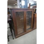 Glazed oak double door bookcase