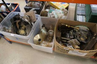 3 x boxes containing quartz clocks, military style buttons, oil lamps, horse brasses, silver