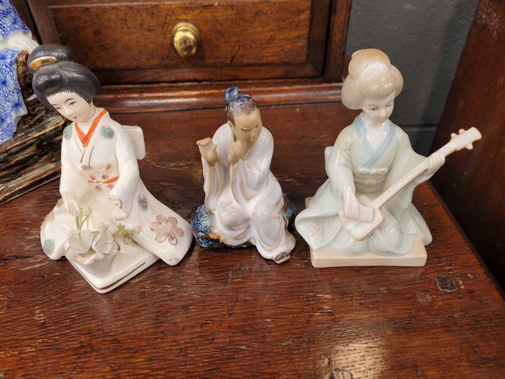 Four ceramic Chinese figures The Guanyin statue is in generally good condition with no chips or - Image 4 of 7