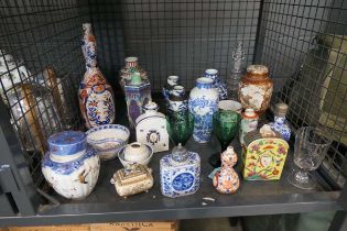 Cage containing blue and white and other vases plus a ginger jar, wine glass, soup bowl and ladle