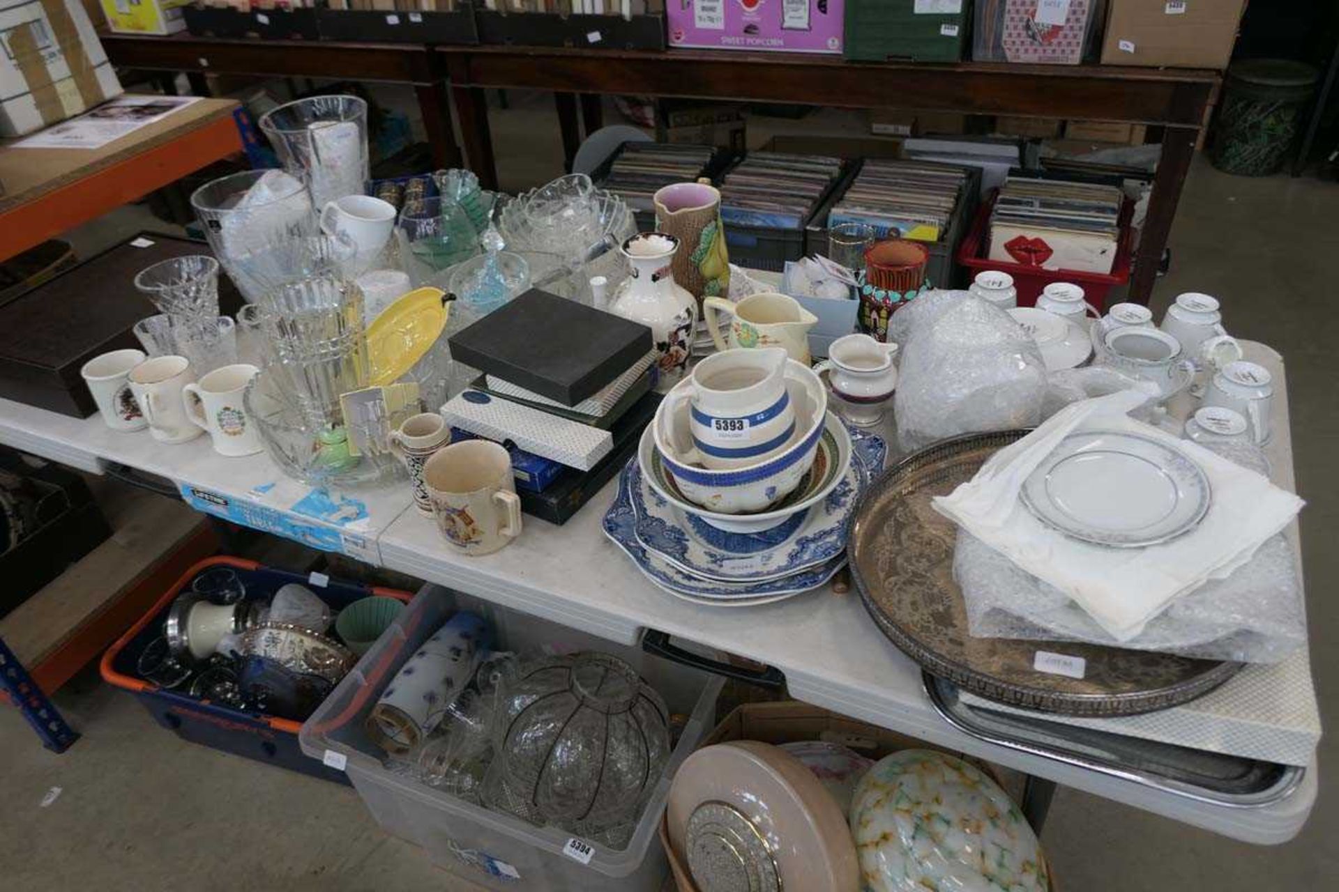 Table top with cutlery canteen, Royal Doulton and other vases, commemorative mugs, blue and white