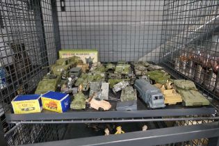 Cage containing play worn military vehicles and artillery pieces