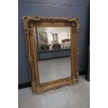 +VAT (2) Rectangular bevelled mirror in gilt floral frame Width 88cm, Height 120cm.Modern frame, few