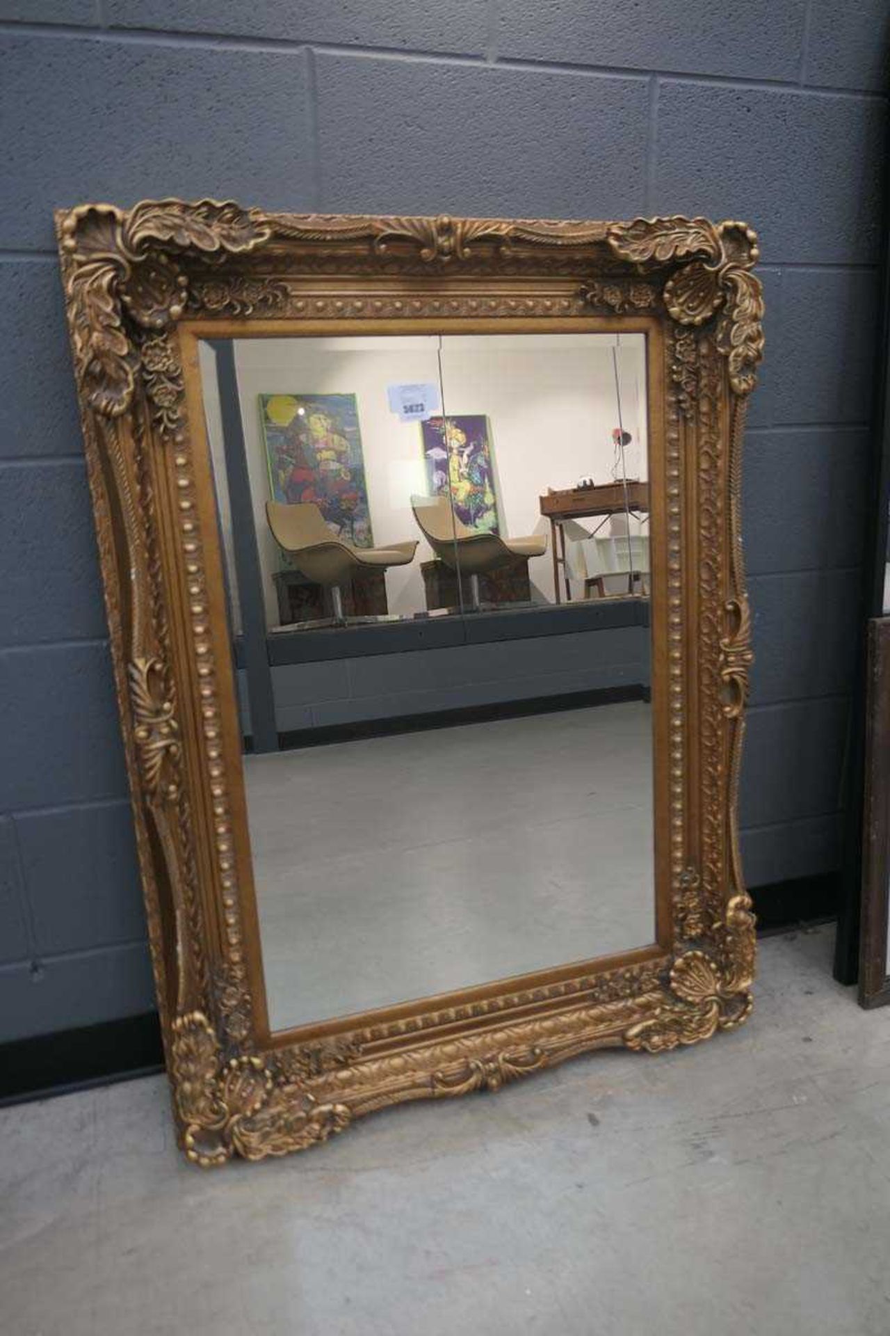 +VAT (2) Rectangular bevelled mirror in gilt floral frame Width 88cm, Height 120cm.Modern frame, few