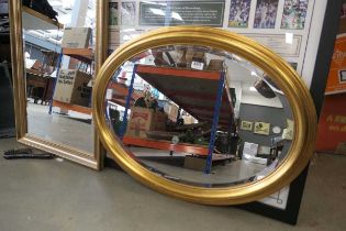 Oval bevelled mirror in gilt frame