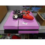 Playstation 4 in pink with a red controller and a power unit