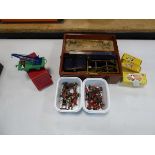 Box containing Dinky Toys, toy soldiers, Hornby Trains train truck and a Magneto electric machine