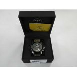 +VAT Boxed Talis and Co. Men's limited ed. chronograph with see-through face, black surround, and