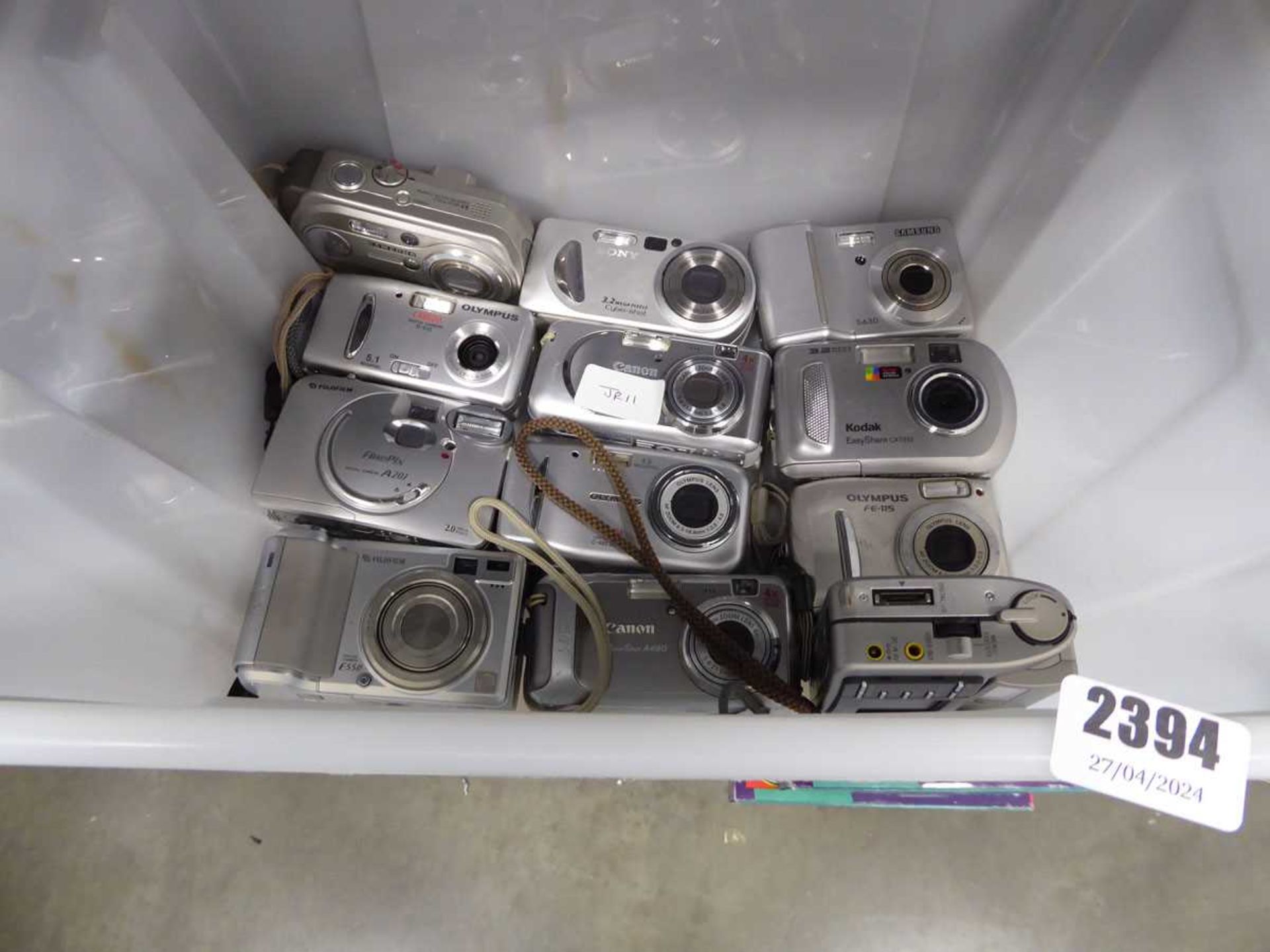 Box containing approx 12 digital cameras of various models