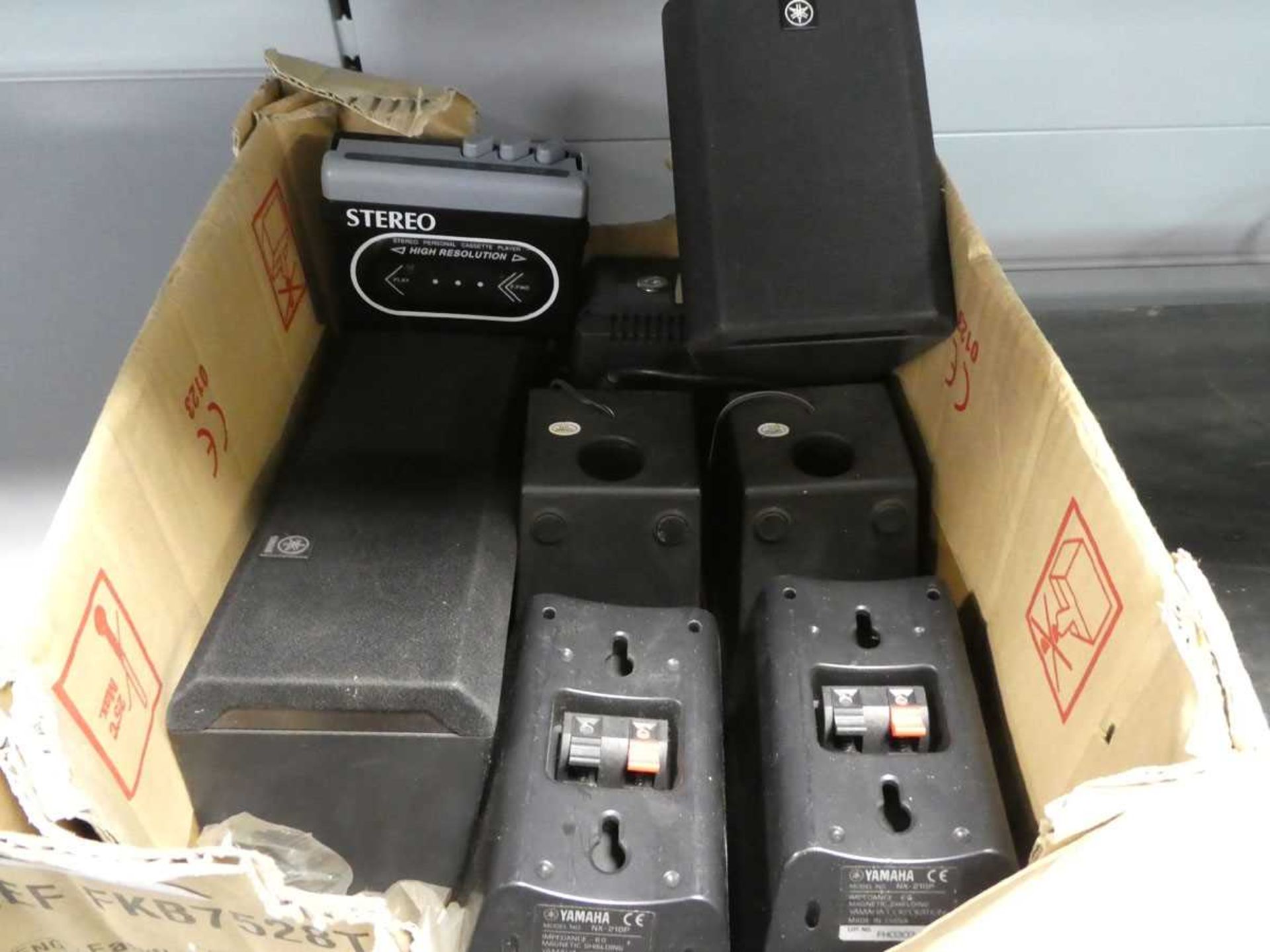 Box containing Yamaha speakers