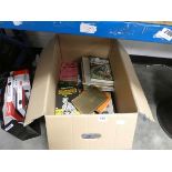 Box containing various books and other items