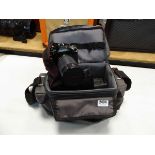 Canon A1 camera with accessories and camera bag