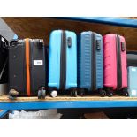 +VAT Medium hard shelled suitcase plus three mini ones