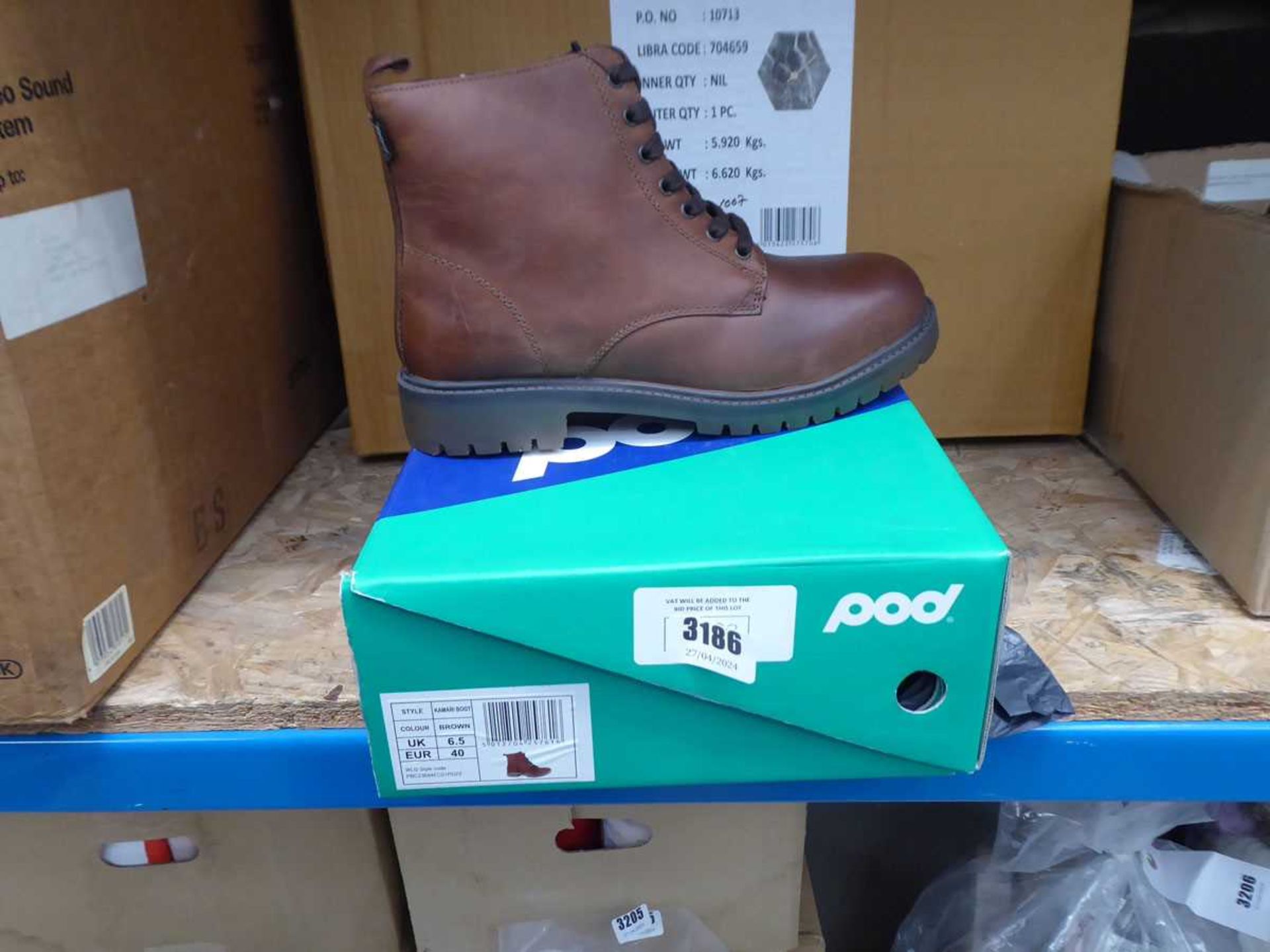 One boxed pair of brown boots size 6.5