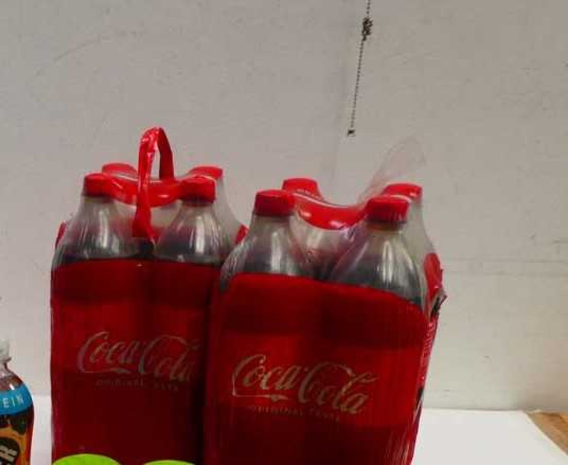 A bag containing 8 bottles of Coca Cola