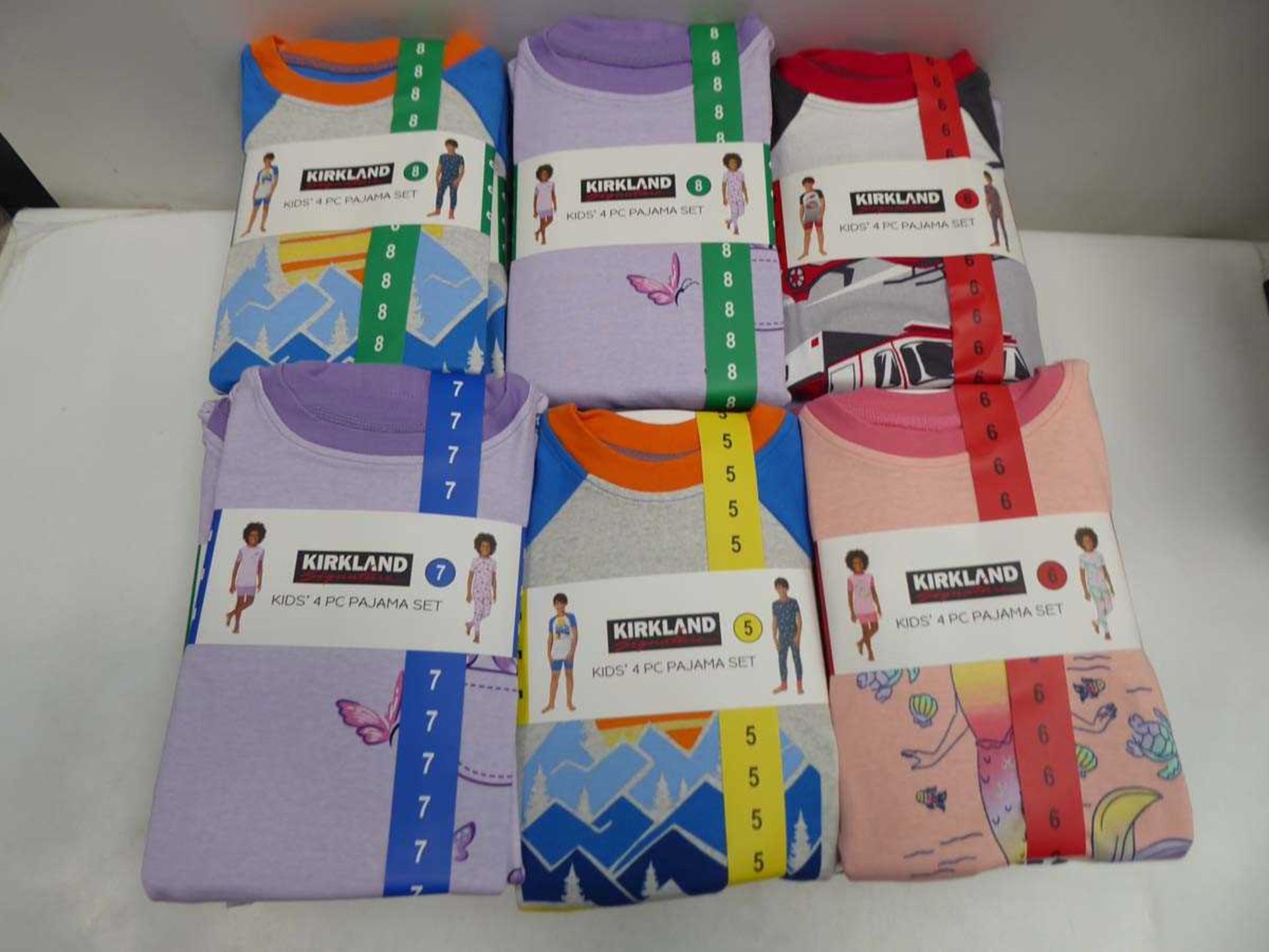 Approx. 30 Kirkland SIgnature kids 4 piece pyjama sets in various colours, sizes, and genders