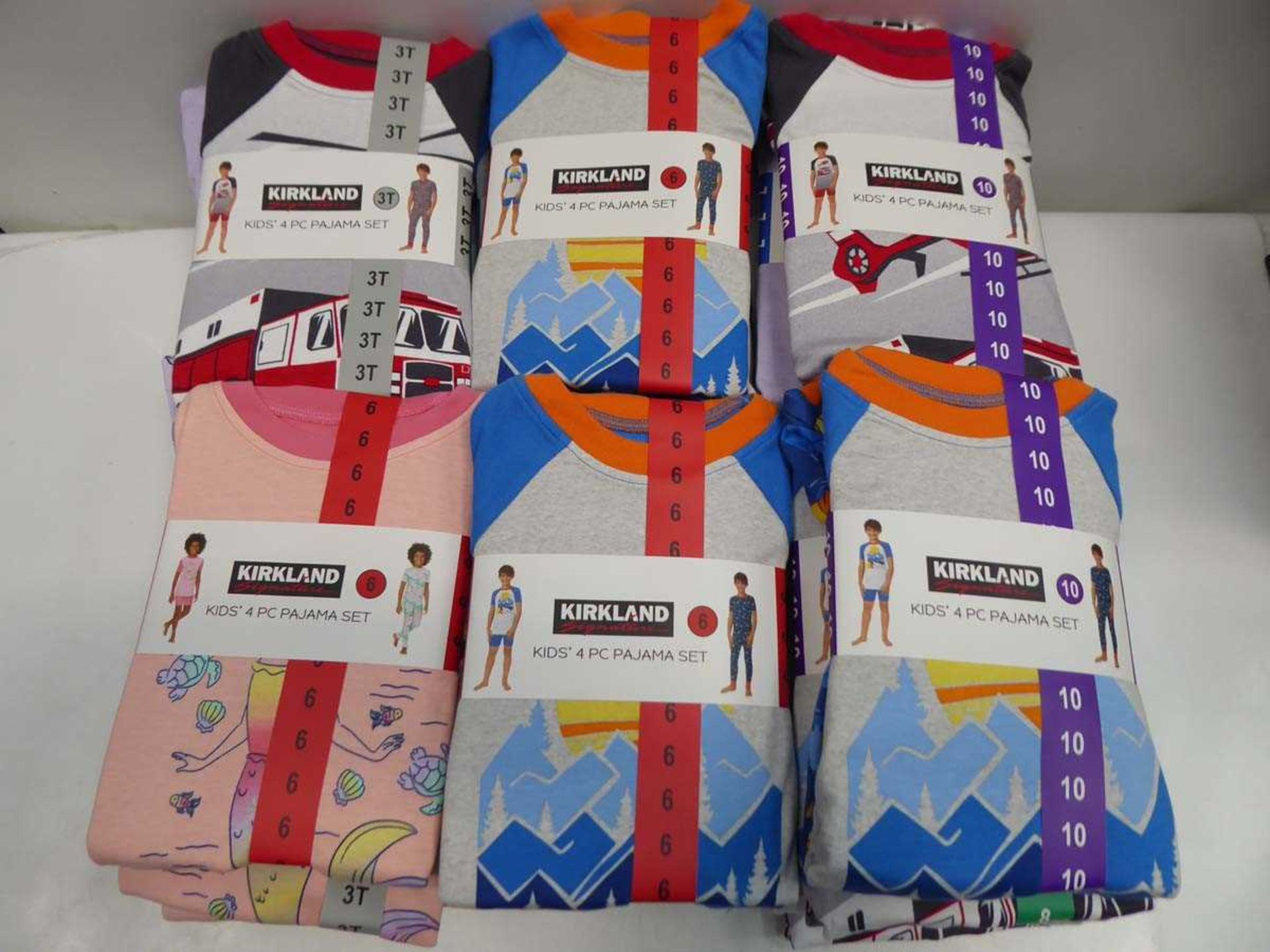 Approx. 30 Kirkland SIgnature kids 4 piece pyjama sets in various colours, sizes, and genders