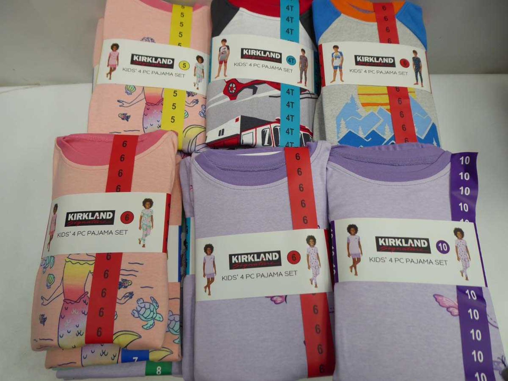 Approx. 30 Kirkland SIgnature kids 4 piece pyjama sets in various colours, sizes, and genders